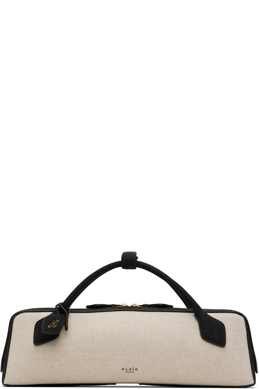 Linen-blend canvas and calfskin suede top handle bag.

· Press-stud tab at fixed rolled carry handles
· Detachable logo tag at handle base
· Logo stamp at face
· Two-way zip closure
· Card slot at interior 
· Suede lining
· Logo-engraved gold-tone hardware 
· H3.5" x W12" x D2.5" 

Supplier color: Noir