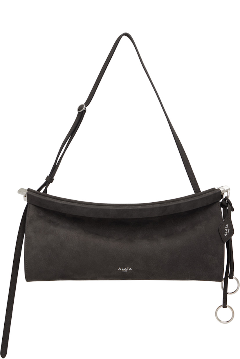 Calfskin nubuck shoulder bag.

· Adjustable shoulder strap
· Silver-tone logo stamp at face
· Detachable logo tag and O-rings at side
· Hinged closure
· Logo-engraved silver-tone hardware
· H5.5" x W12" x D3.5"

Supplier color: Anthracite