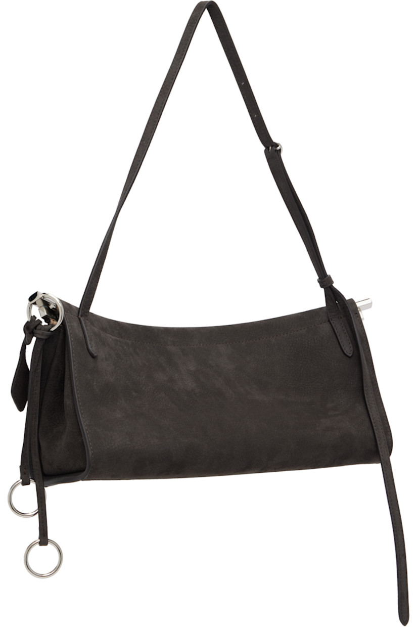 Calfskin nubuck shoulder bag.

· Adjustable shoulder strap
· Silver-tone logo stamp at face
· Detachable logo tag and O-rings at side
· Hinged closure
· Logo-engraved silver-tone hardware
· H5.5" x W12" x D3.5"

Supplier color: Anthracite