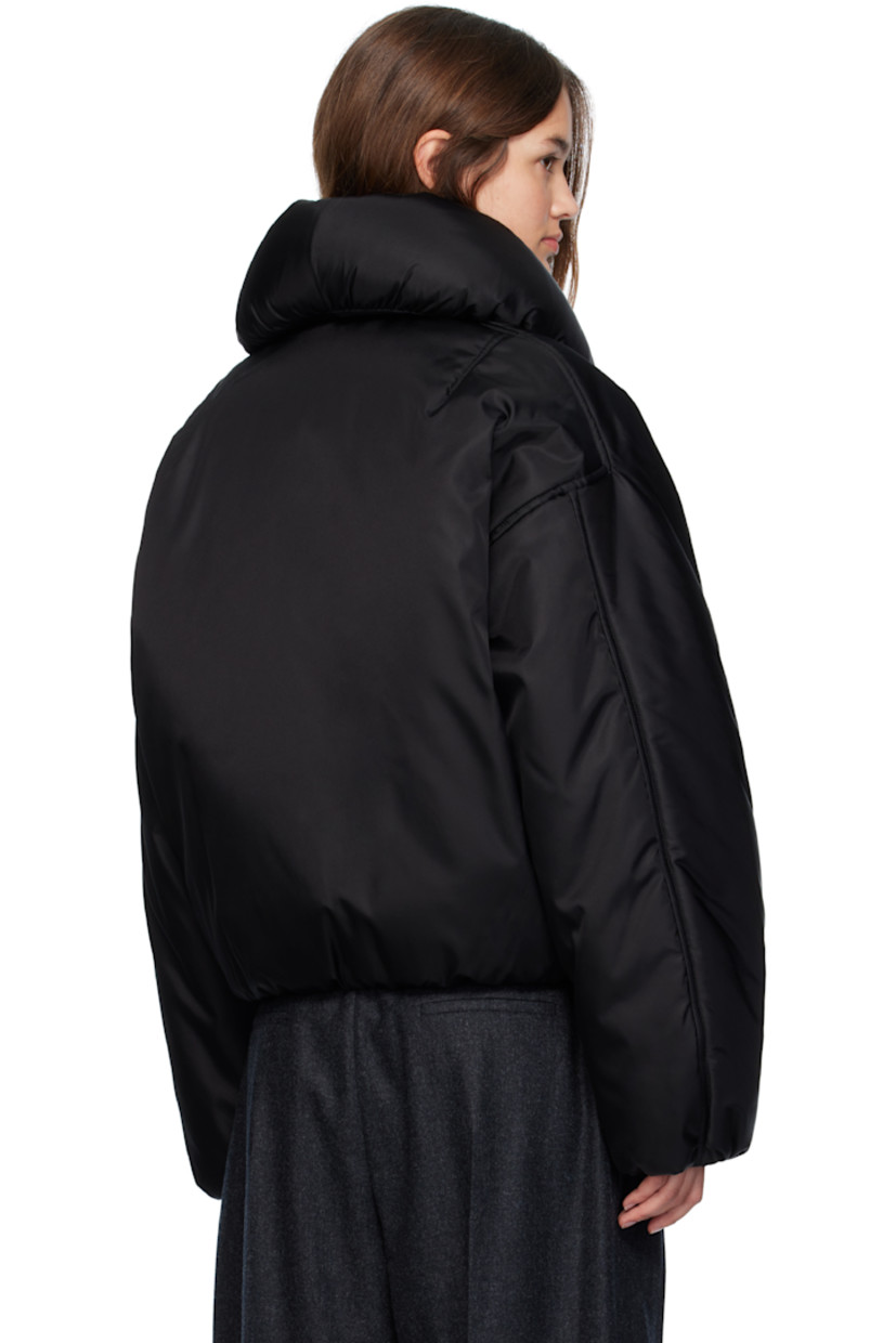 Insulated stretch nylon taffeta bomber jacket.

· Rolled shawl collar 
· Zip closure 
· Seam pockets at waist
· Elasticized hem and cuffs
· Dropped shoulders
· Full plain-woven lining 

Supplier color: Black