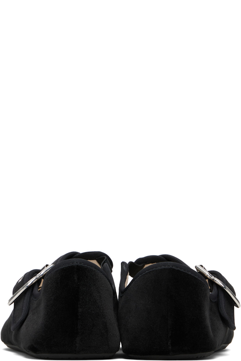 Velvet ballerina flats.

· Elasticized crisscrossing pin-buckle straps 
· Grosgrain trim at collar 
· Canvas lining 
· Rubber sole 

Supplier color: Black
