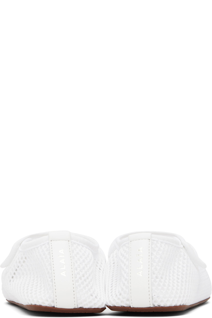 Sheer fishnet ballerina flats in white.

· Elasticized collar 
· Velcro fastening at outer side
· Grained lambskin trim with logo stamp at heel 
· Logo patch at padded lambskin footbed
· Treaded rubber sole

Supplier color: Optic white
