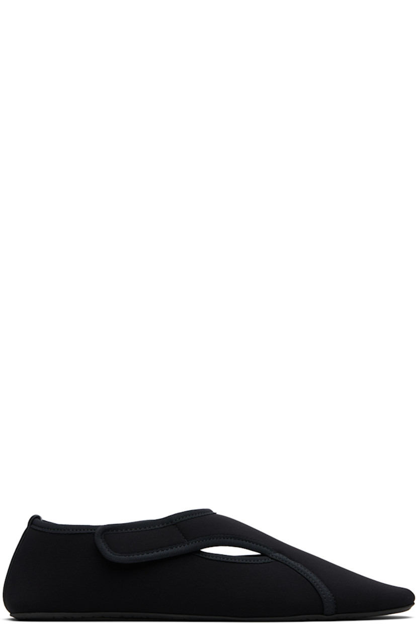 Neoprene ballerina flats. 

· Grosgrain trim throughout
· Cutouts at vamp
· Velcro fastening
· Leather logo patch at heel counter
· Treaded rubber sole

Supplier color: Noir