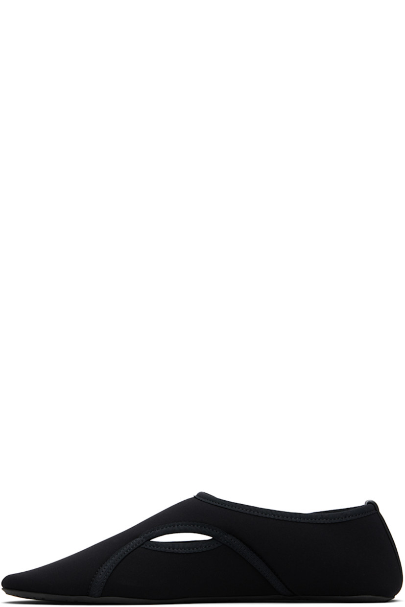 Neoprene ballerina flats. 

· Grosgrain trim throughout
· Cutouts at vamp
· Velcro fastening
· Leather logo patch at heel counter
· Treaded rubber sole

Supplier color: Noir
