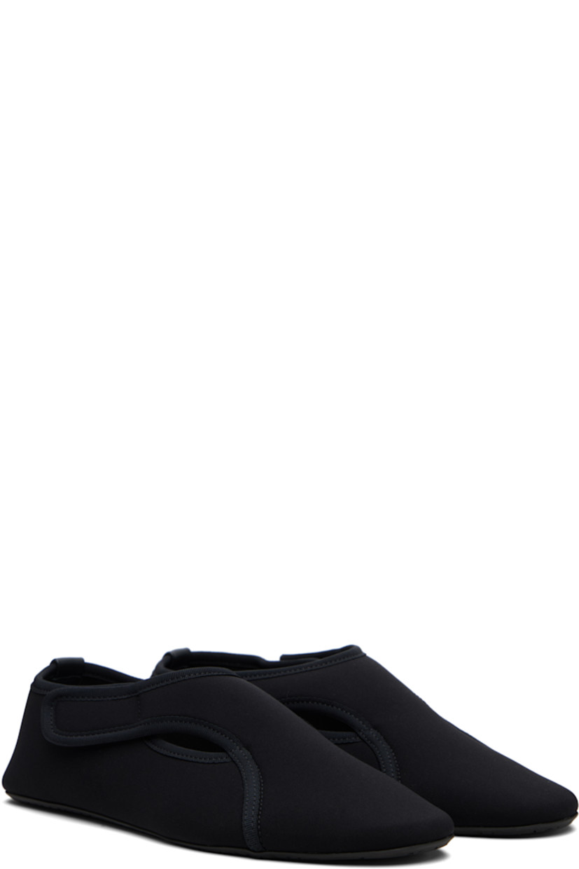 Neoprene ballerina flats. 

· Grosgrain trim throughout
· Cutouts at vamp
· Velcro fastening
· Leather logo patch at heel counter
· Treaded rubber sole

Supplier color: Noir
