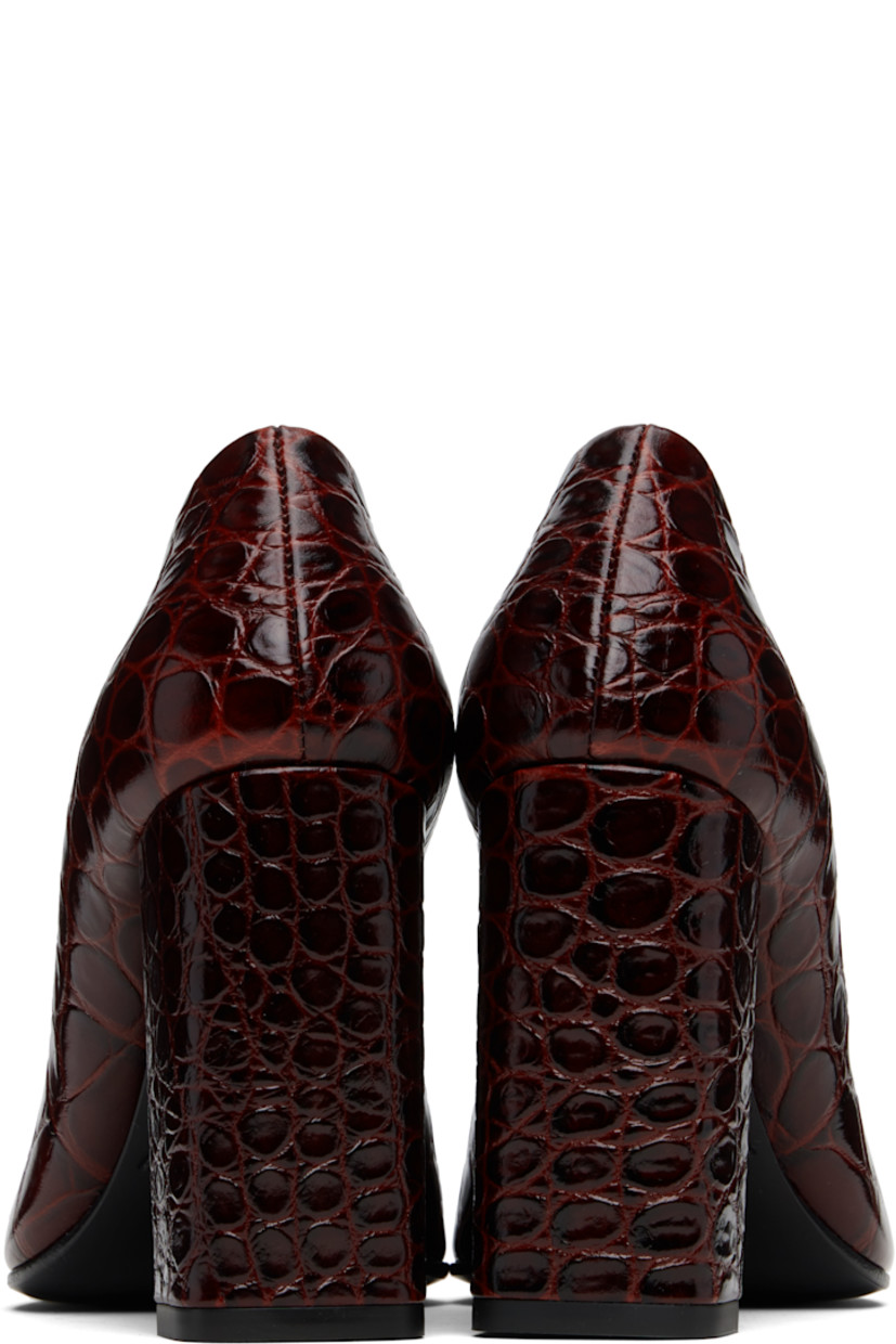 Croc-embossed calfskin heels. 

· Pointed toe
· Buffed leather lining
· Covered block heel with rubber injection
· Leather sole with rubber injection
· Heel: H3.5"

Supplier color: Rouge grenat