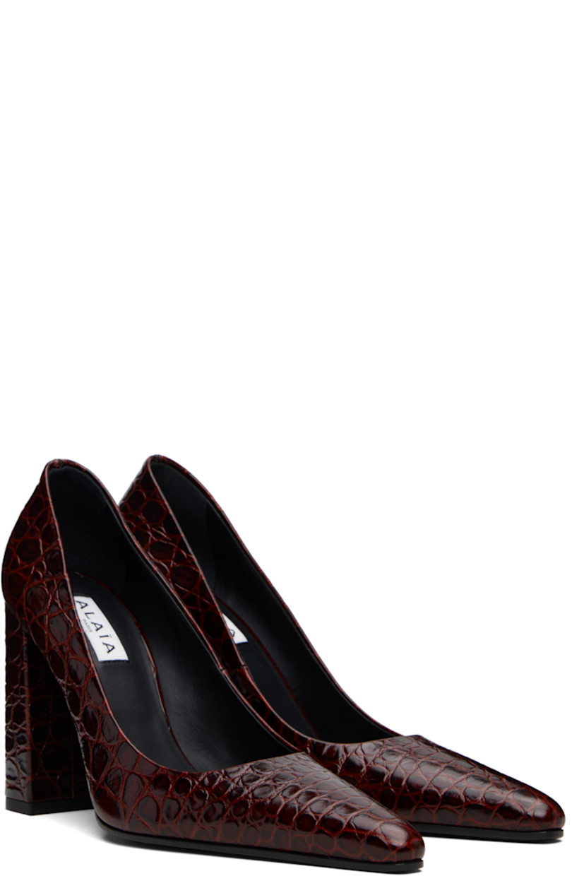 Croc-embossed calfskin heels. 

· Pointed toe
· Buffed leather lining
· Covered block heel with rubber injection
· Leather sole with rubber injection
· Heel: H3.5"

Supplier color: Rouge grenat