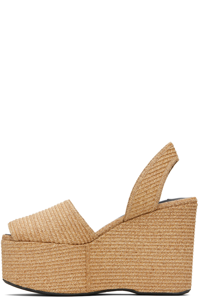 Woven paper straw heeled sandals.

· Open toe 
· Slingback strap at heel
· Lambskin lining
· Covered platform midsole and wedge heel
· Rubber sole 
· Platform: H2.5" 
· Heel: H4.5"

Supplier color: Natural