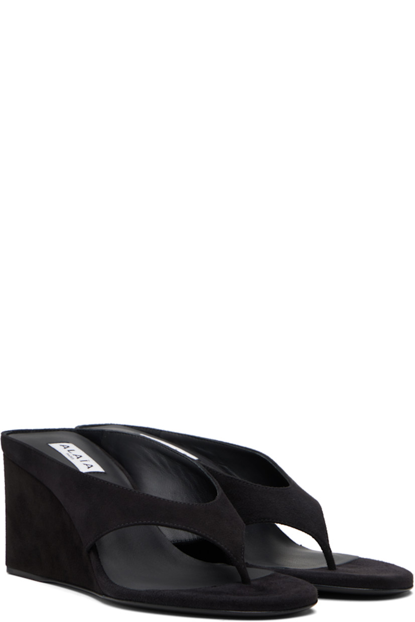 Goatskin suede heeled sandals.

· Open toe 
· Thong-style strap at vamp
· Lambskin lining
· Covered wedge heels with rubber injection
· Calfskin sole 
· Heel: H3"

Supplier color: Black