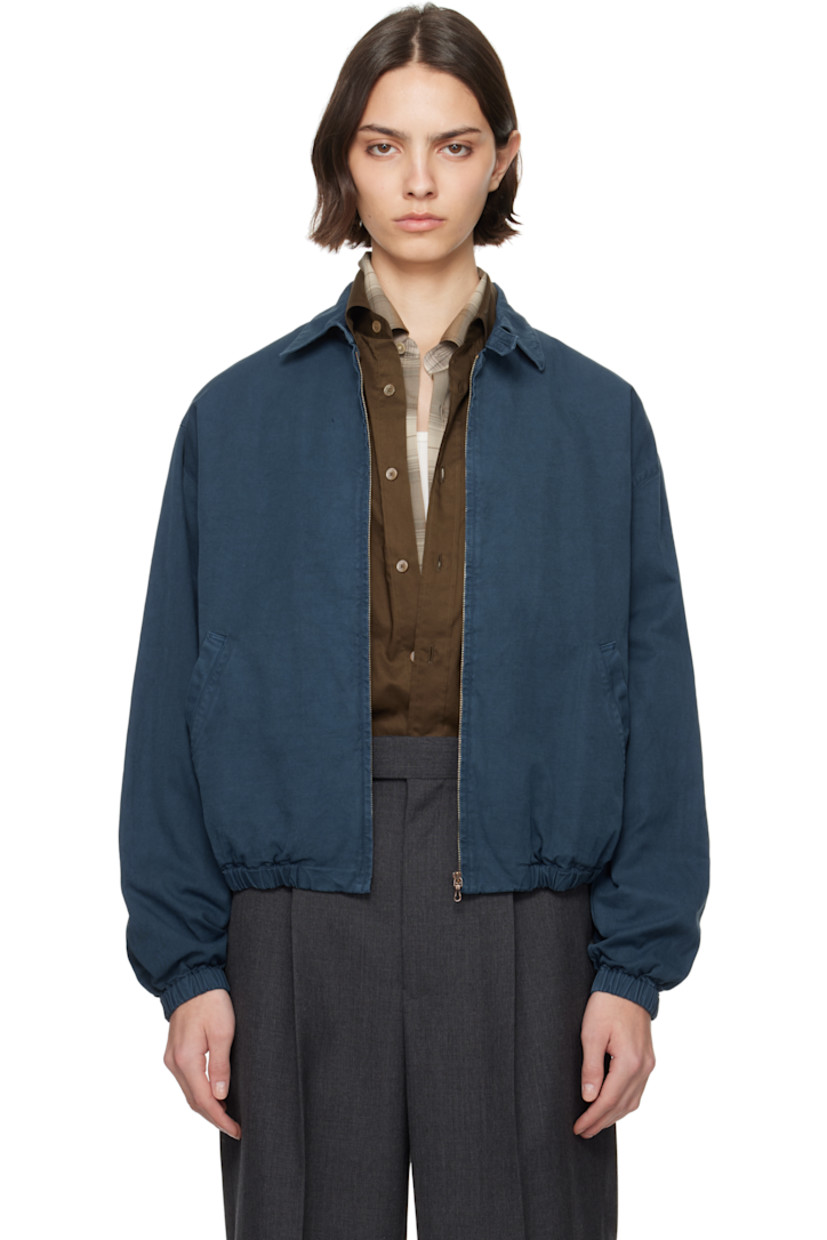 Handcrafted cotton gabardine jacket in navy. Fading throughout. 

· Garment-dyed
· Button tab at spread collar
· Zip closure
· Welt pockets
· Elasticized hem and cuffs
· Dropped shoulders
· Antiqued copper-tone hardware

Supplier color: Dyed navy