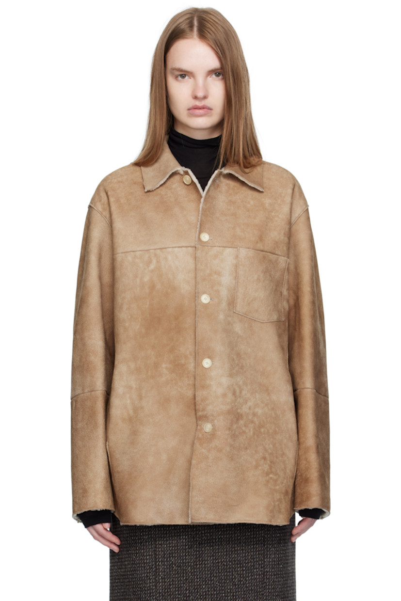 Paneled lambskin suede jacket.

· Exposed seams throughout
· Spread collar
· Button closure
· Patch pocket at chest
· Seam pockets at waist
· Shearling interior

Supplier color: Beige