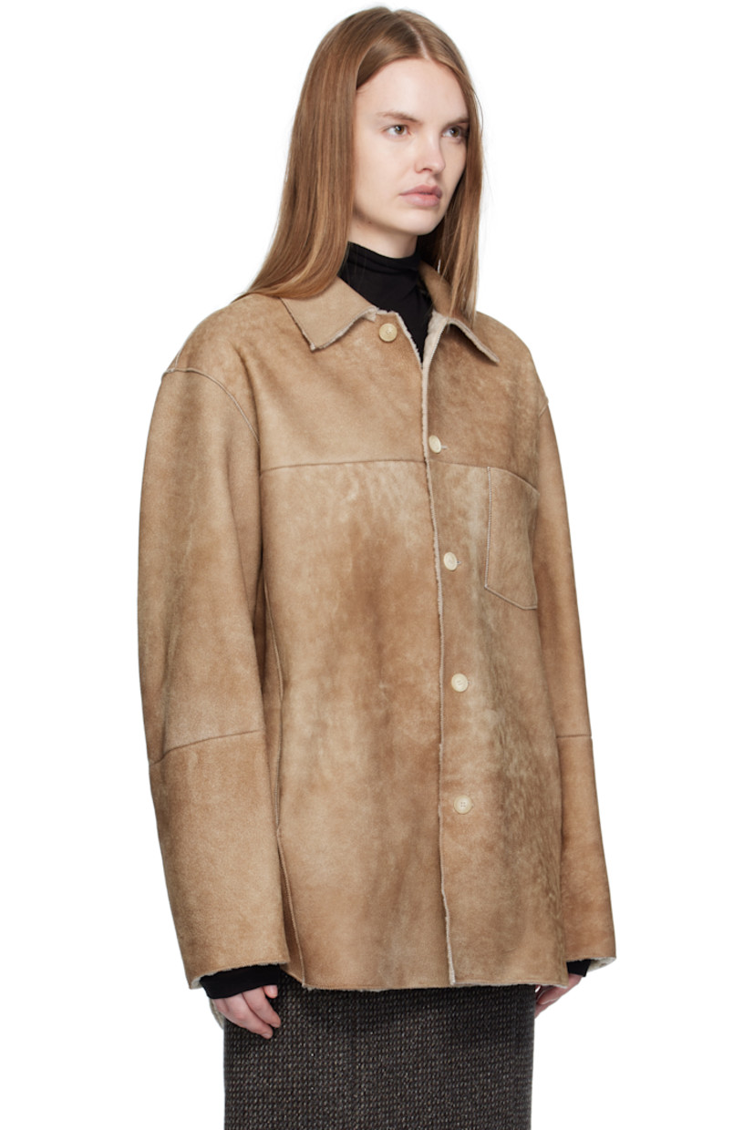 Paneled lambskin suede jacket.

· Exposed seams throughout
· Spread collar
· Button closure
· Patch pocket at chest
· Seam pockets at waist
· Shearling interior

Supplier color: Beige