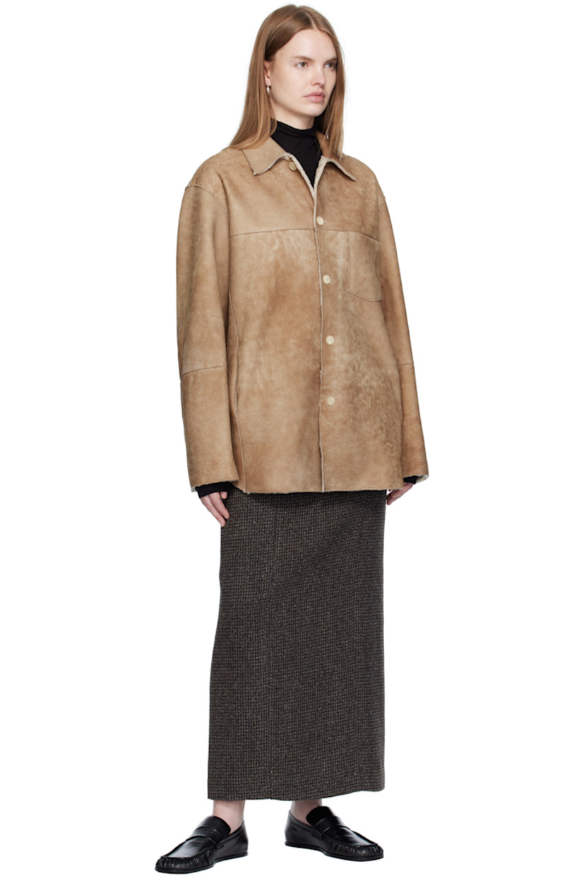 Paneled lambskin suede jacket.

· Exposed seams throughout
· Spread collar
· Button closure
· Patch pocket at chest
· Seam pockets at waist
· Shearling interior

Supplier color: Beige