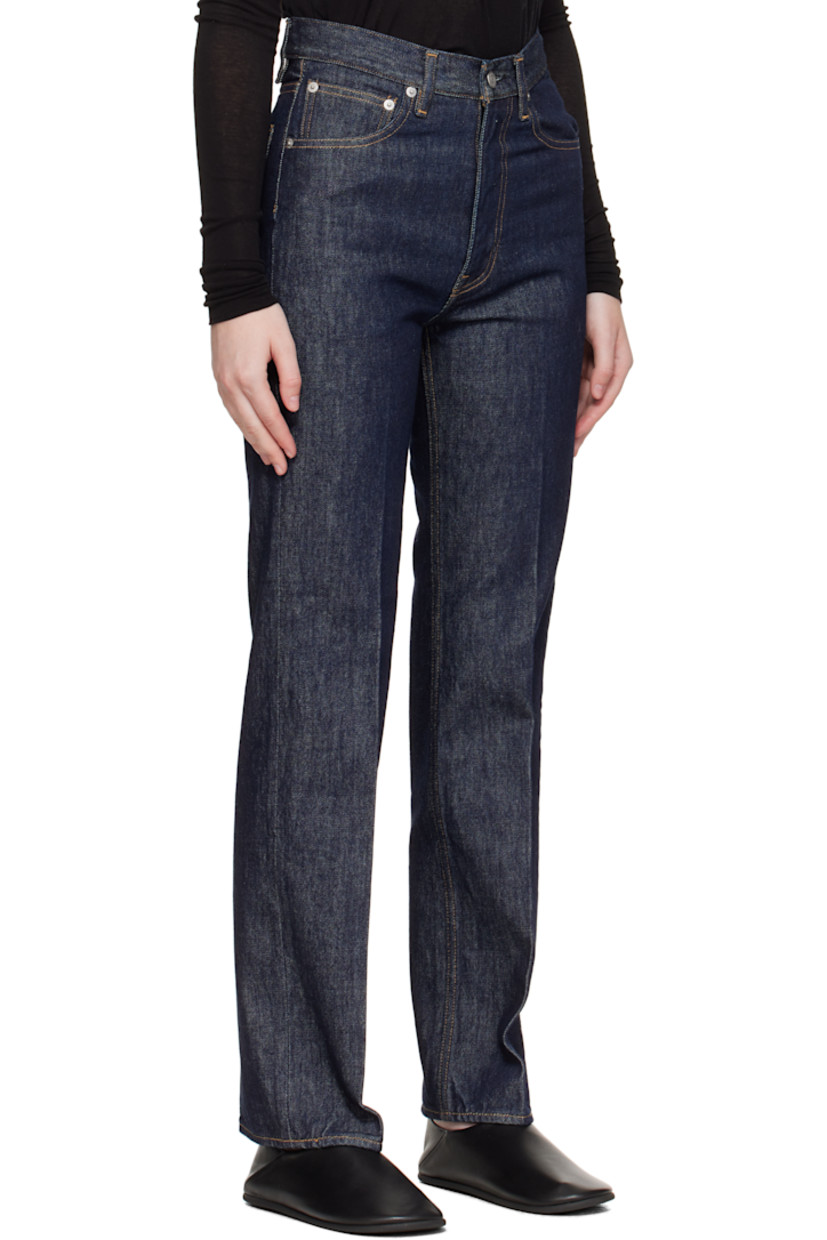 Indigo rope-dyed non-stretch denim jeans.

· Slim-fit, straight-leg
· Belt loops
· Five-pocket styling
· Zip fly
· Creased legs
· Logo-engraved silver-tone hardware
· Contrast stitching in tan

Supplier color: Indigo