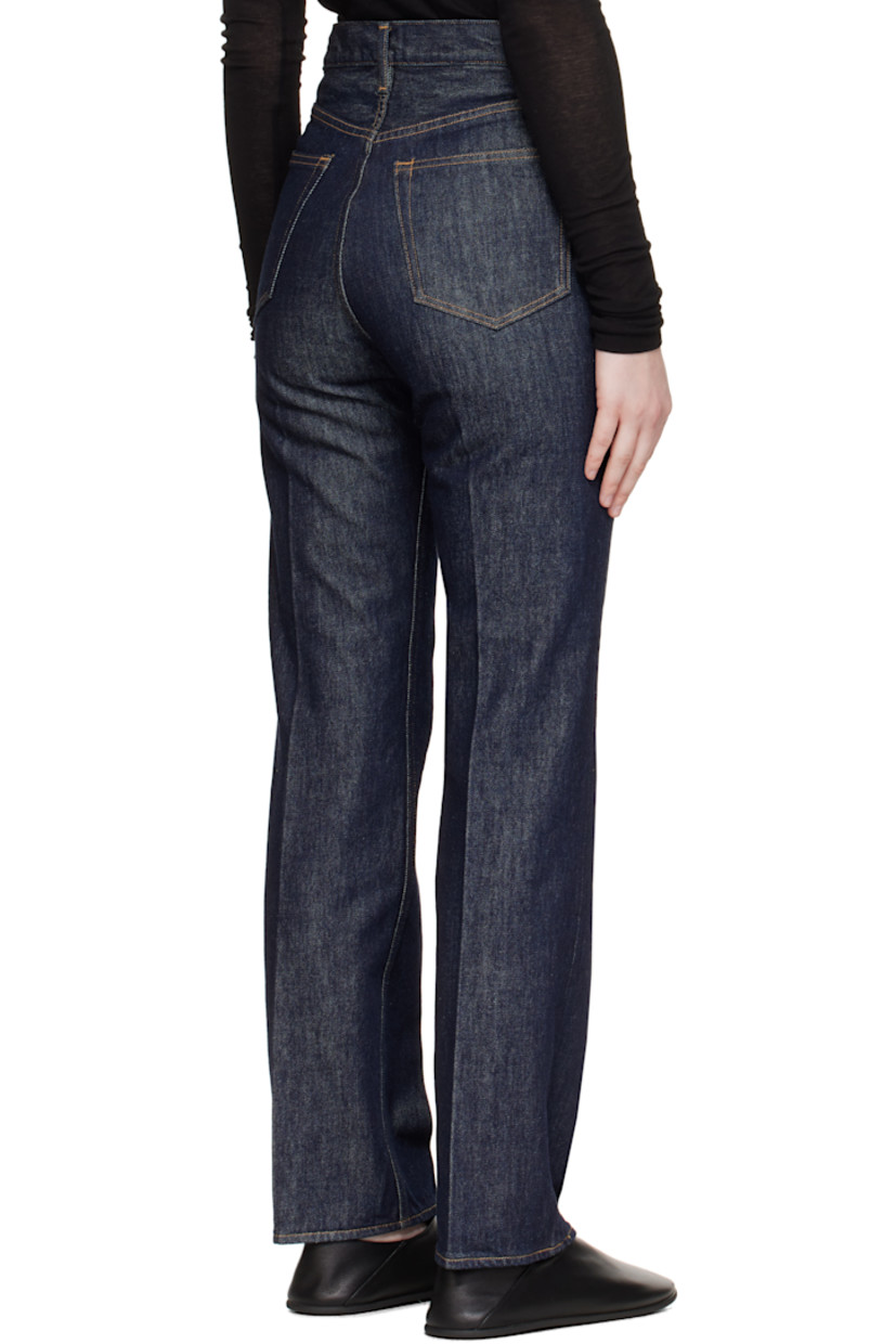 Indigo rope-dyed non-stretch denim jeans.

· Slim-fit, straight-leg
· Belt loops
· Five-pocket styling
· Zip fly
· Creased legs
· Logo-engraved silver-tone hardware
· Contrast stitching in tan

Supplier color: Indigo