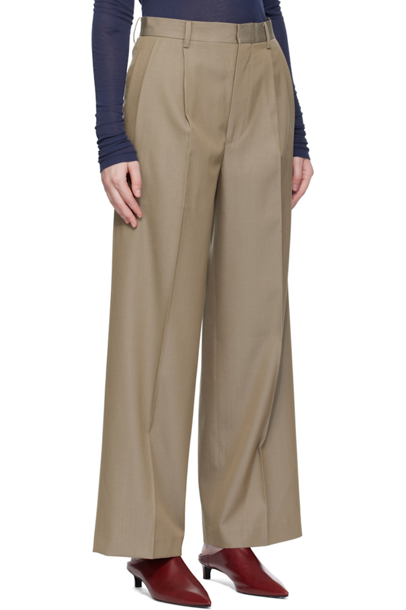 Lightweight wool gabardine trousers.

· Wide-leg
· Belt loops
· Four-pocket styling
· Zip fly
· Pleats at front
· Creased legs

Supplier color: Khaki chambray