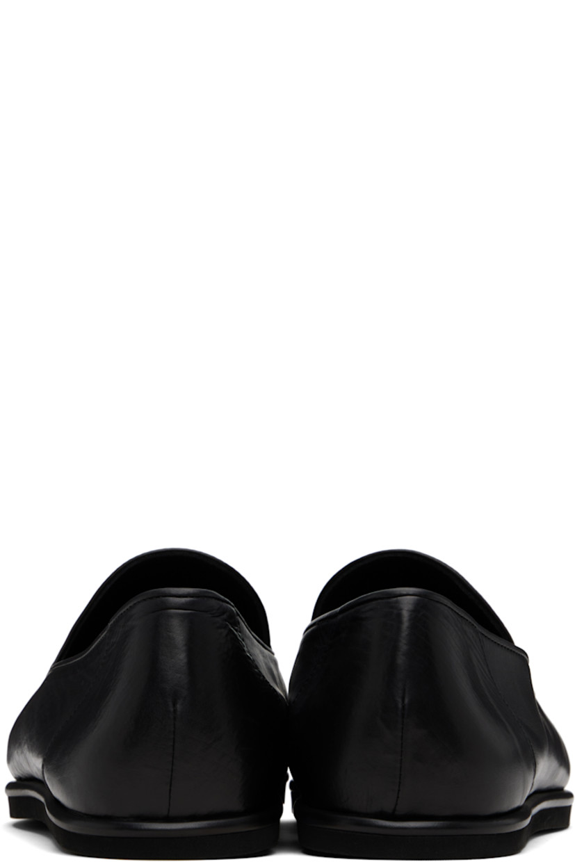 Handcrafted grained calfskin slip-on loafers.

· Buffed calfskin lining
· Textured rubber sole

Supplier color: Black