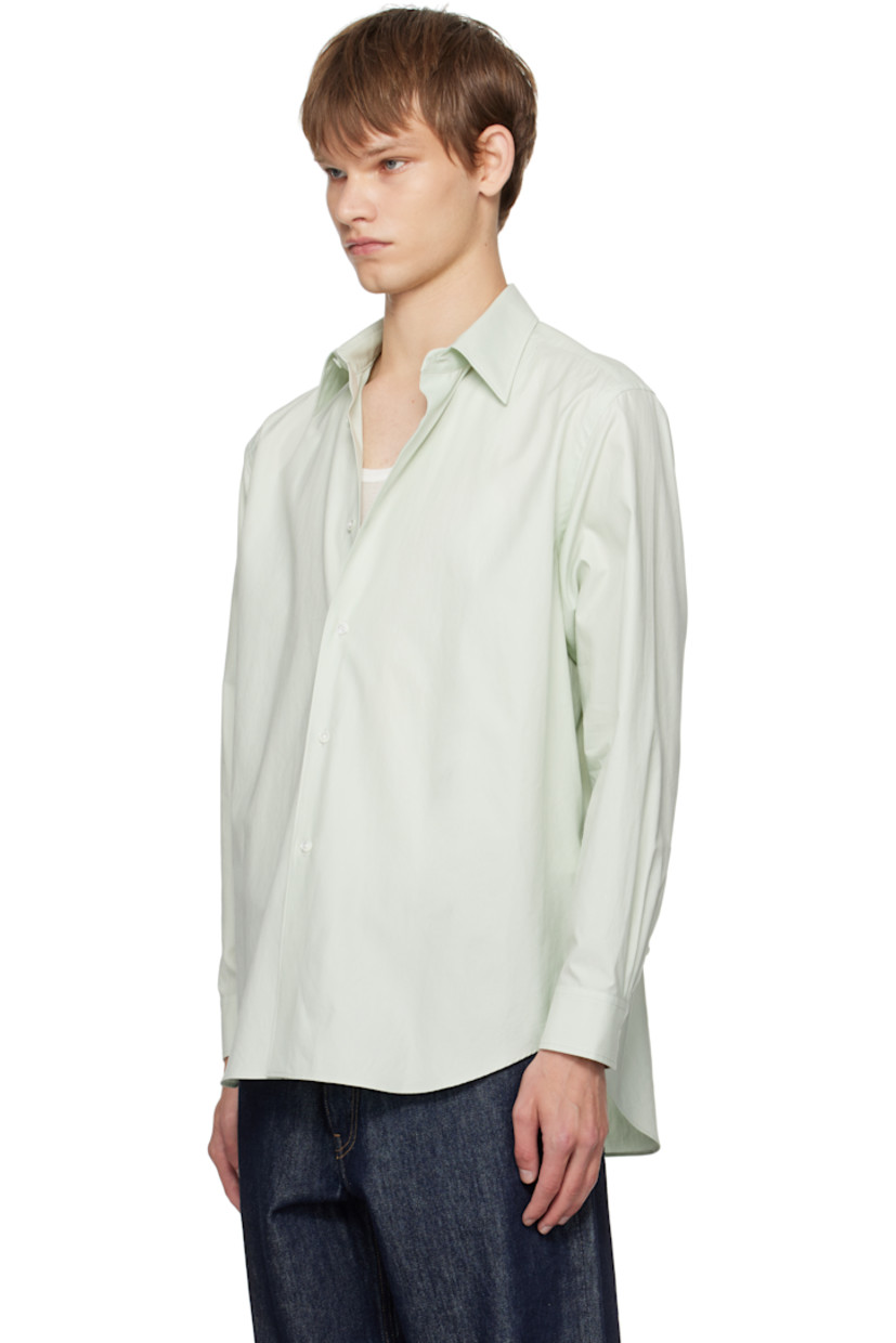 Washed extra-long staple Finx cotton twill shirt.

· Spread collar
· Button closure
· Shirttail hem
· Buttoned barrel cuffs
· Twin pleats at back yoke
· Mother-of-pearl hardware

Supplier color: Light khaki