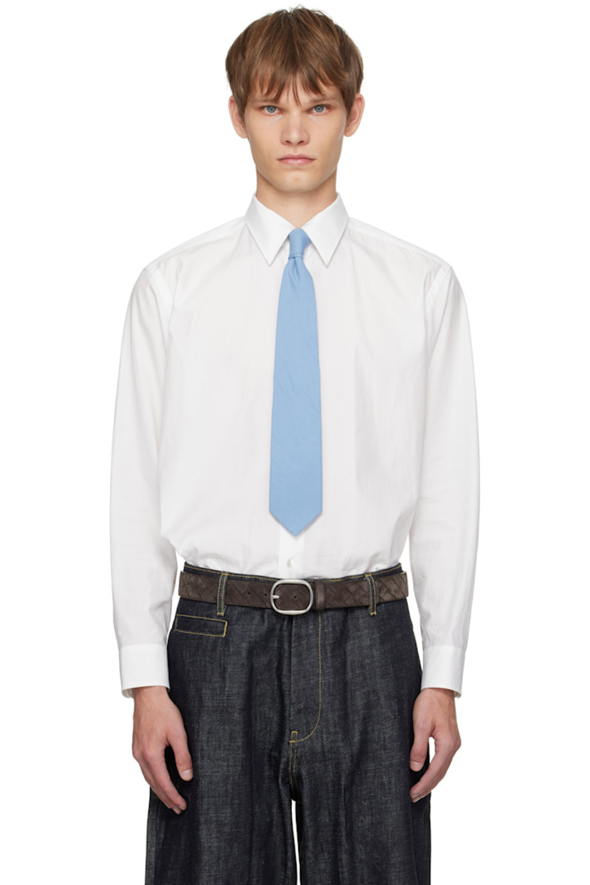 Washed extra-long staple Finx cotton twill shirt.

· Spread collar
· Button closure
· Shirttail hem
· Buttoned barrel cuffs
· Twin pleats at back yoke
· Mother-of-pearl hardware

Supplier color: White