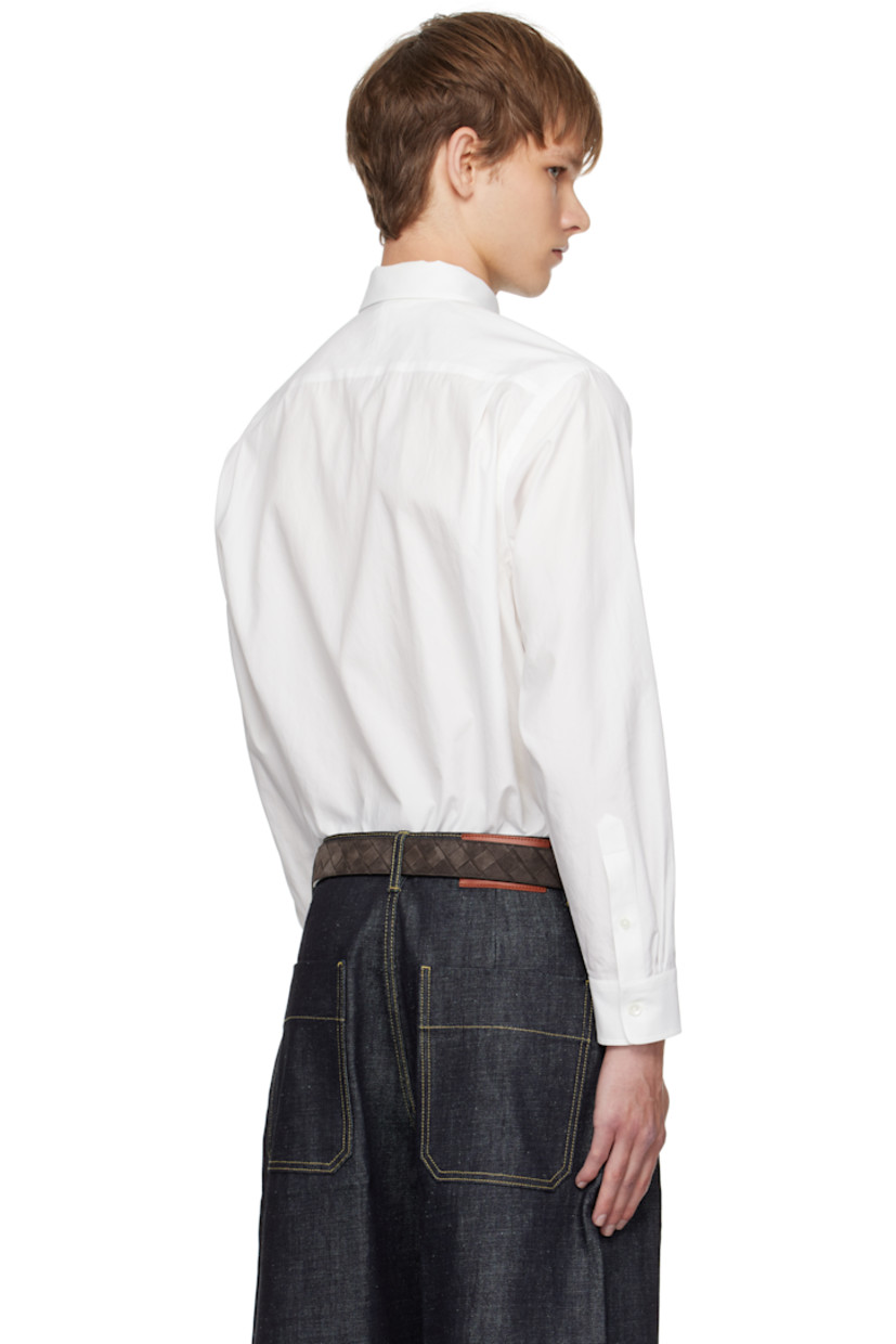 Washed extra-long staple Finx cotton twill shirt.

· Spread collar
· Button closure
· Shirttail hem
· Buttoned barrel cuffs
· Twin pleats at back yoke
· Mother-of-pearl hardware

Supplier color: White