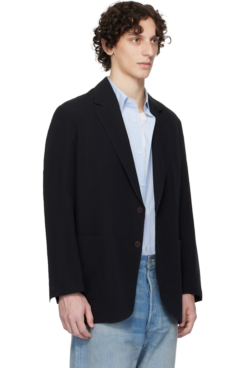 Lightweight extra-long staple cotton- and wool-blend gabardine blazer.

· Notched lapel
· Button closure
· Patch pockets
· Vented cuffs
· Central vent at back hem
· Patch pocket at interior
· Unlined

Supplier color: Black