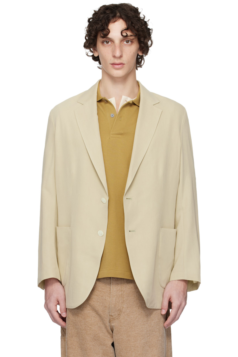 Lightweight extra-long staple cotton- and wool-blend gabardine blazer.

· Notched lapel
· Button closure
· Patch pockets
· Vented cuffs
· Central vent at back hem
· Patch pocket at interior
· Unlined

Supplier color: Light khaki