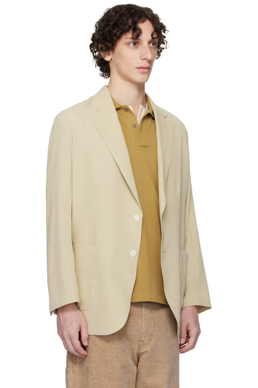 Lightweight extra-long staple cotton- and wool-blend gabardine blazer.

· Notched lapel
· Button closure
· Patch pockets
· Vented cuffs
· Central vent at back hem
· Patch pocket at interior
· Unlined

Supplier color: Light khaki