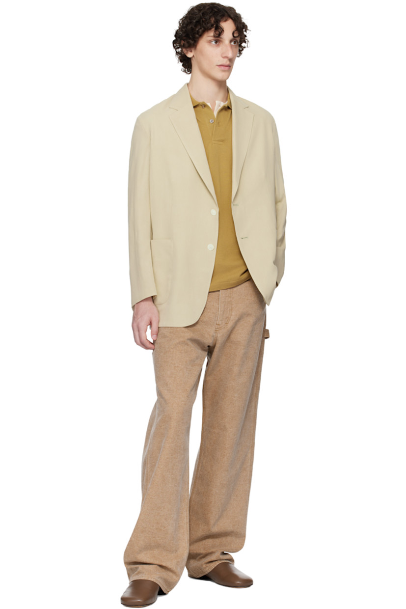 Lightweight extra-long staple cotton- and wool-blend gabardine blazer.

· Notched lapel
· Button closure
· Patch pockets
· Vented cuffs
· Central vent at back hem
· Patch pocket at interior
· Unlined

Supplier color: Light khaki