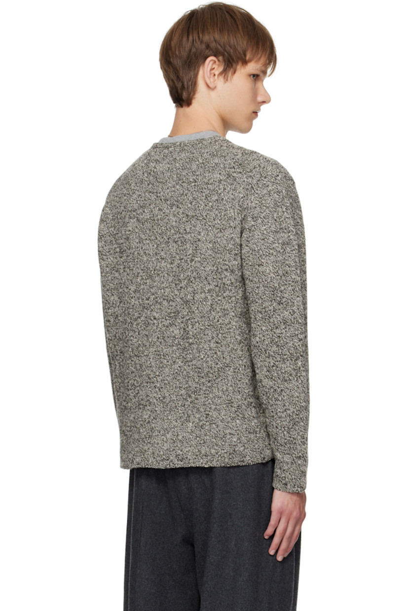 Knit wool- and silk-blend sweater.

· Lightweight
· Marling throughout
· Rib-knit crewneck, hem, and cuffs

Supplier color: Top black