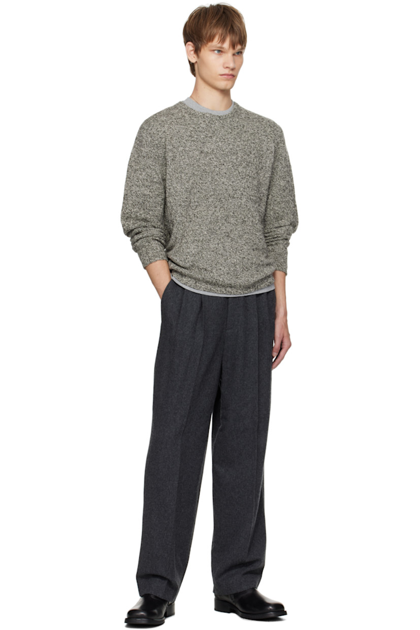 Knit wool- and silk-blend sweater.

· Lightweight
· Marling throughout
· Rib-knit crewneck, hem, and cuffs

Supplier color: Top black