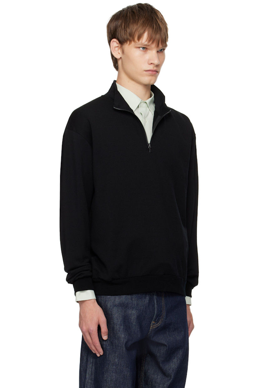 Lightweight wool-blend fleece sweatshirt.

· Stand collar
· Half-zip closure
· Rib-knit hem and cuffs

Supplier color: Black
