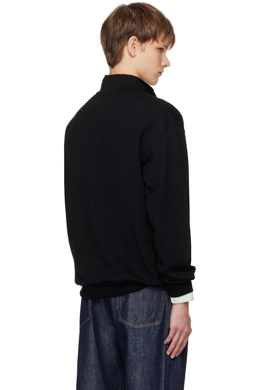 Lightweight wool-blend fleece sweatshirt.

· Stand collar
· Half-zip closure
· Rib-knit hem and cuffs

Supplier color: Black