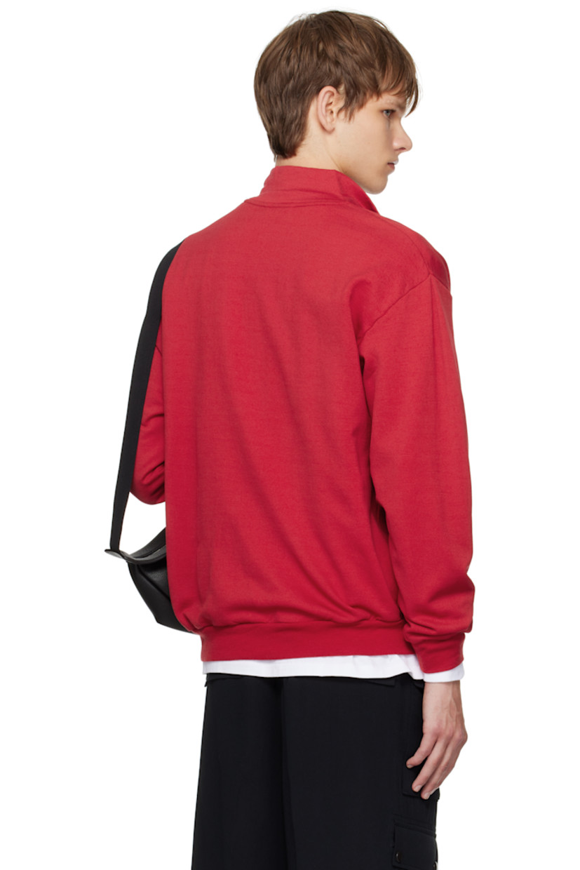Lightweight wool-blend fleece sweatshirt.

· Stand collar
· Half-zip closure
· Rib-knit hem and cuffs

Supplier color: Red