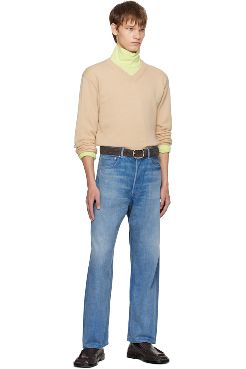 Lightweight knit cashmere sweater.

· Rib-knit V-neck, hem, and cuffs
· Dropped shoulders

Supplier color: Beige