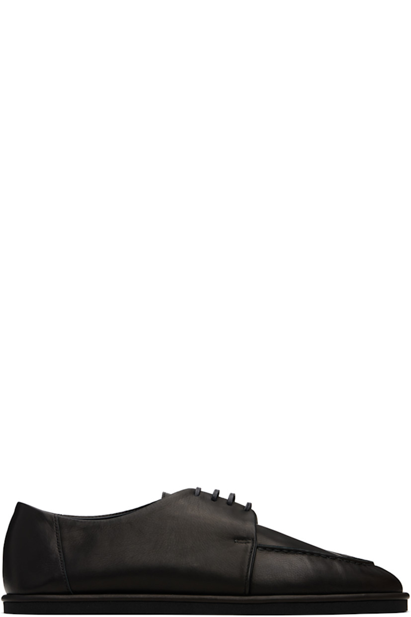 Grained calfskin oxfords.

· Moc toe
· Lace-up closure
· Treaded rubber sole

Supplier color: Black