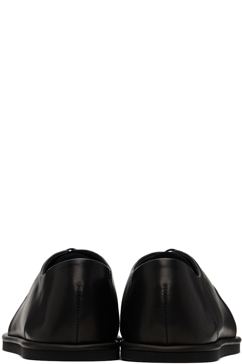 Grained calfskin oxfords.

· Moc toe
· Lace-up closure
· Treaded rubber sole

Supplier color: Black