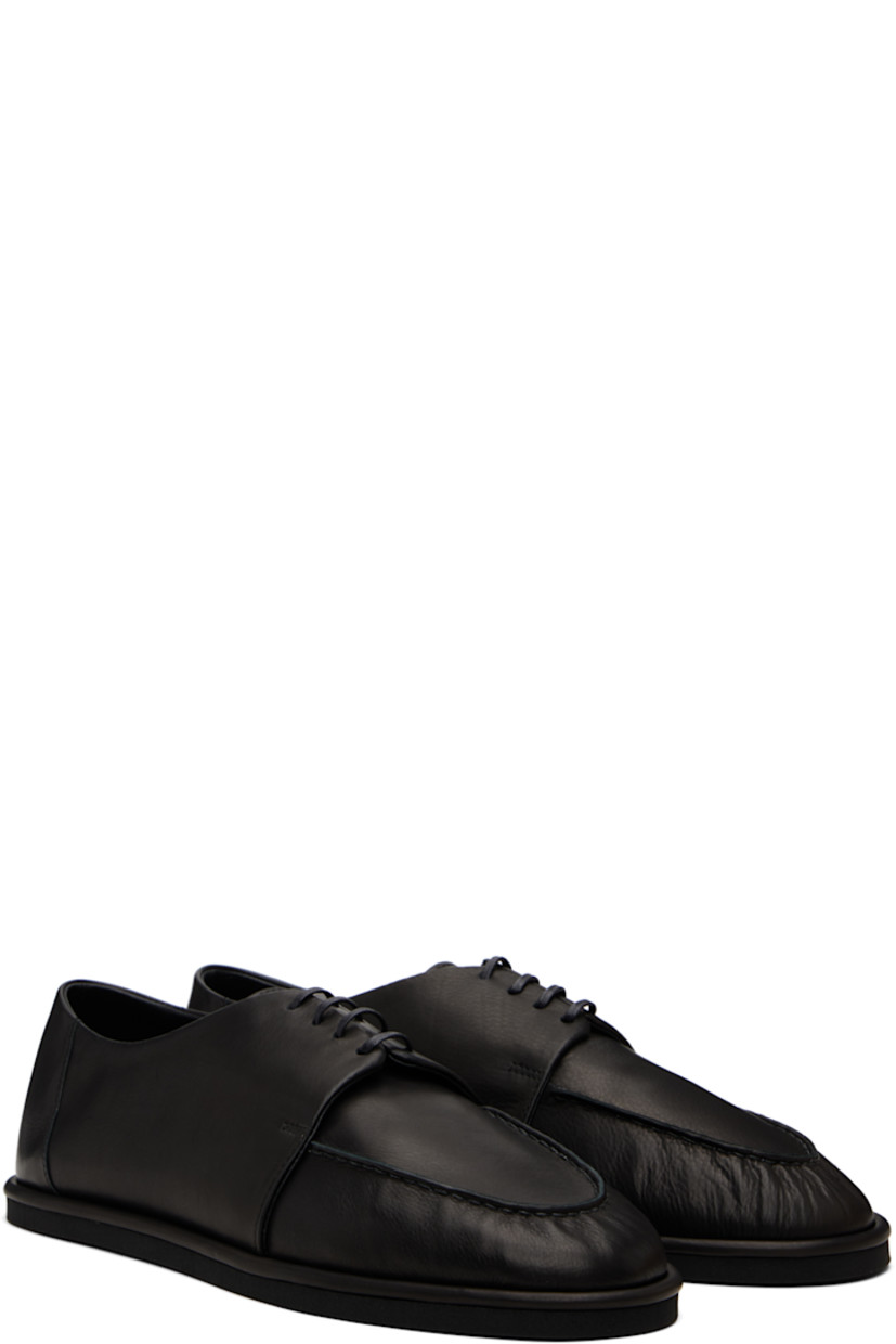 Grained calfskin oxfords.

· Moc toe
· Lace-up closure
· Treaded rubber sole

Supplier color: Black