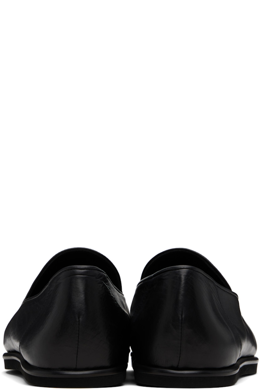 Handcrafted grained calfskin slip-on loafers.

· Buffed calfskin lining
· Textured rubber sole

Supplier color: Black