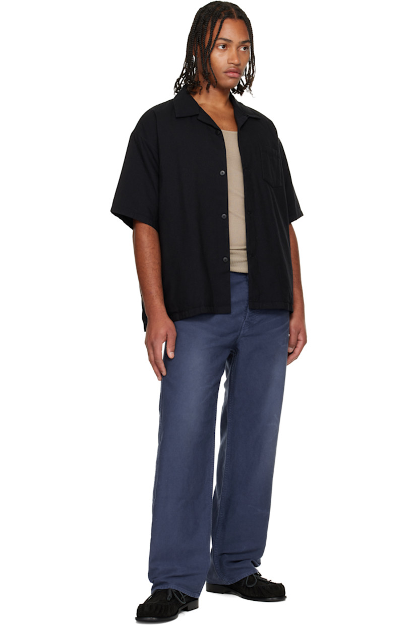 Down-filled plain-woven wool-blend shirt. 

· Button fastening at open spread collar 
· Button closure
· Patch pocket at chest
· Dropped shoulders
· Full plain-woven cotton- and silk-blend lining 
· Buffalo horn hardware 

Supplier color: Black