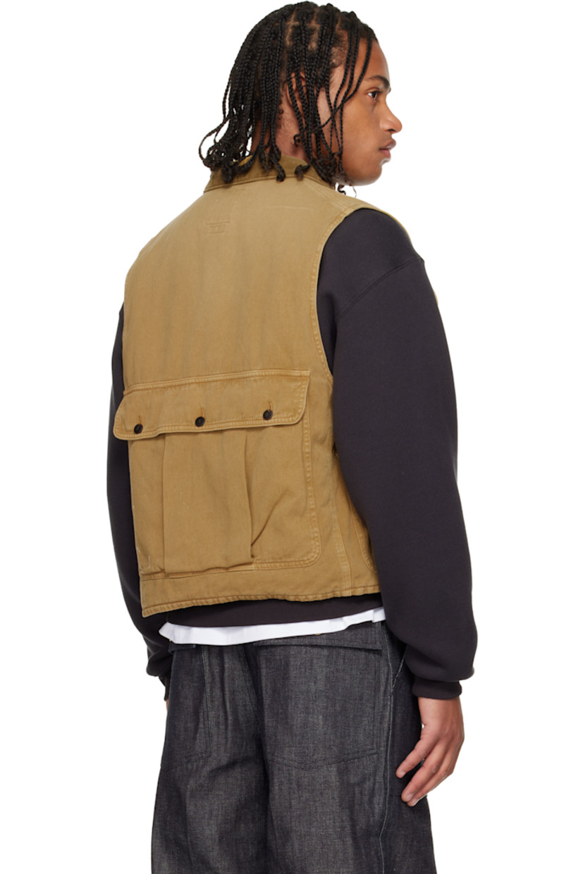 Non-stretch denim vest. 

· Subtle fading throughout 
· Corduroy spread collar 
· Button closure
· Flap pockets at front and back

Supplier color: Lt brown
