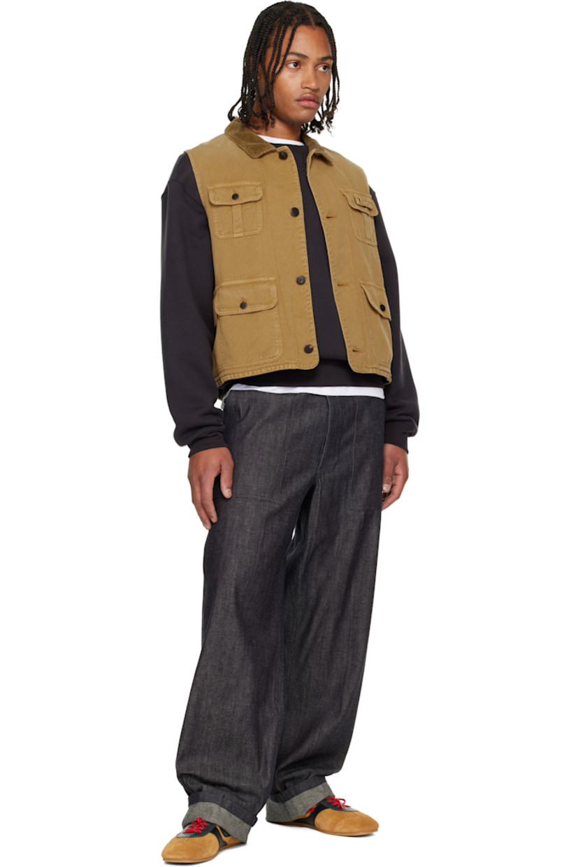 Non-stretch denim vest. 

· Subtle fading throughout 
· Corduroy spread collar 
· Button closure
· Flap pockets at front and back

Supplier color: Lt brown