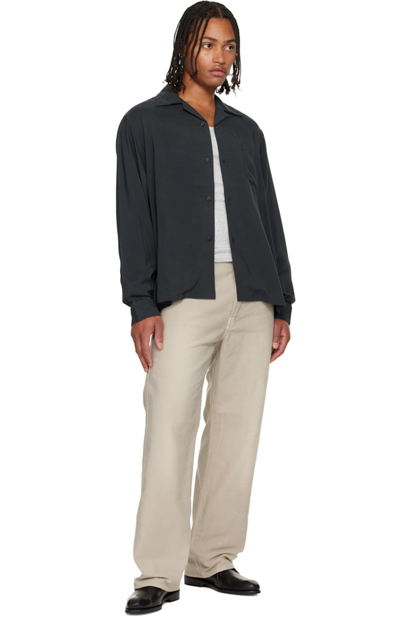 Rayon twill shirt. 

· Open spread collar
· Button closure
· Patch pocket at chest
· Buttoned barrel cuffs

Supplier color: Black
