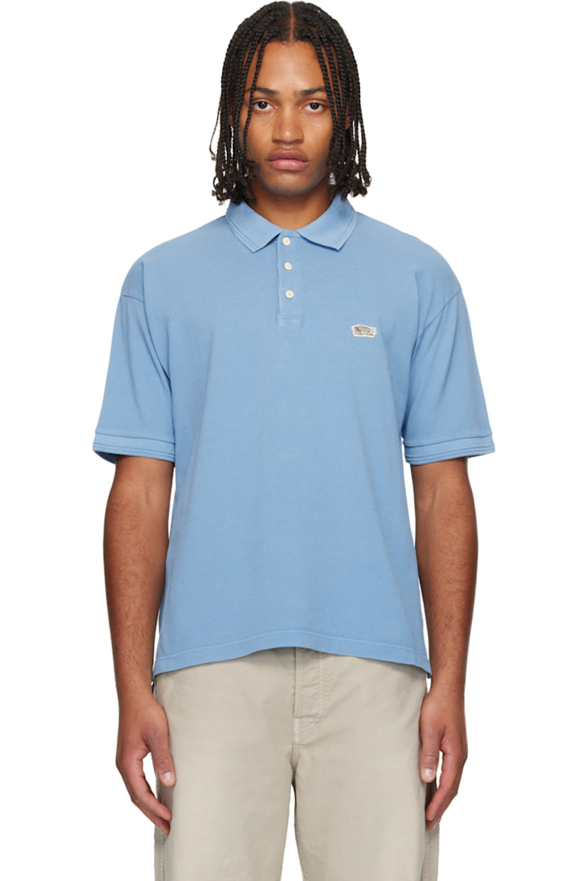 Cotton piqué polo. 

· Rib-knit spread collar and cuffs
· Three-button placket 
· Embroidered logo patch at chest
· Tennis-tail hem 

Supplier color: Lt blue