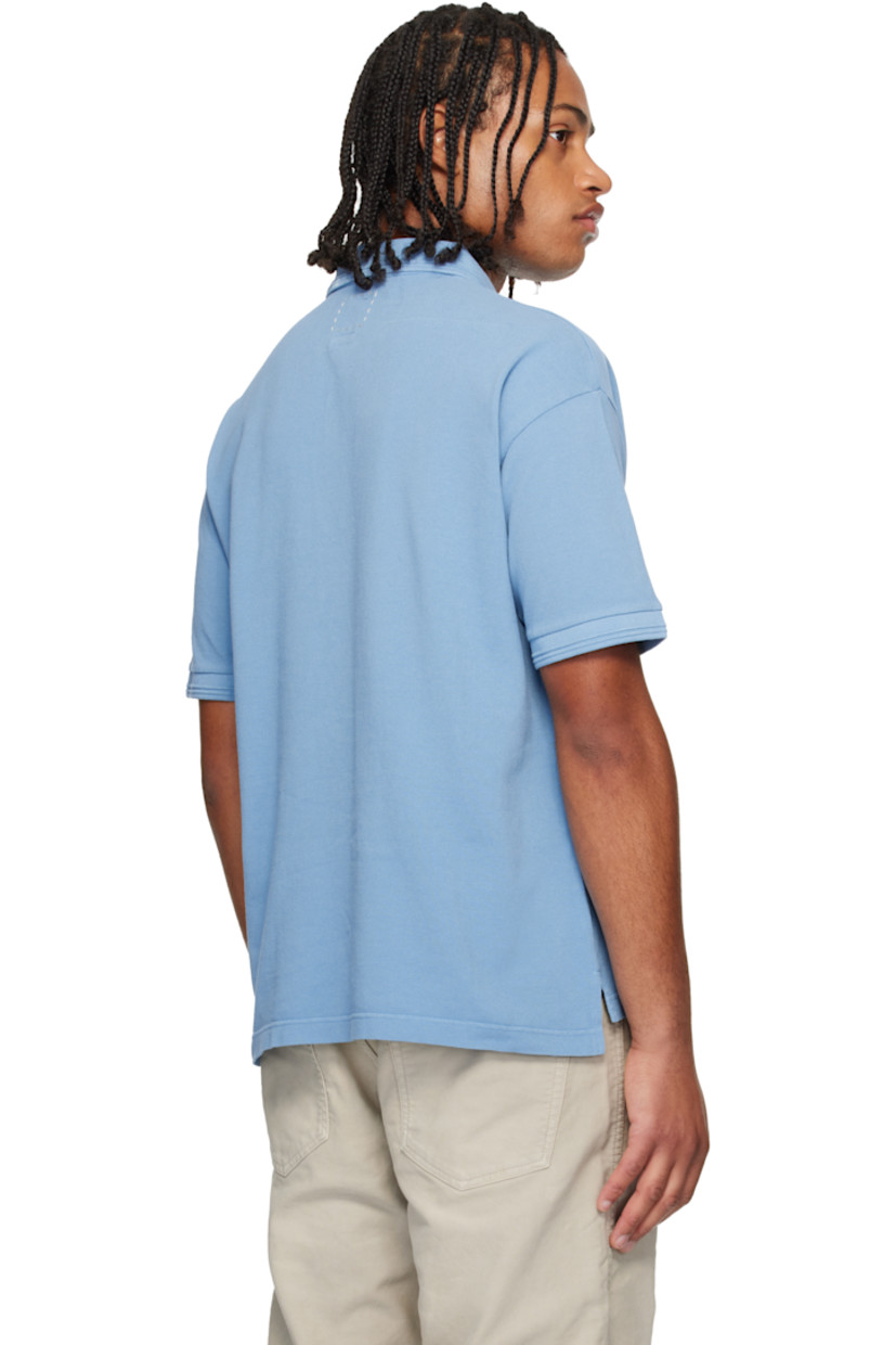 Cotton piqué polo. 

· Rib-knit spread collar and cuffs
· Three-button placket 
· Embroidered logo patch at chest
· Tennis-tail hem 

Supplier color: Lt blue