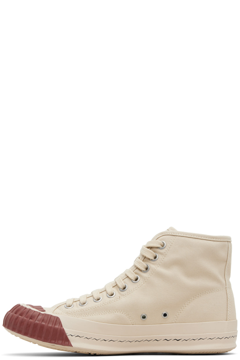 Low-top cotton canvas sneakers.

· Textured rubber cap toe 
· Lace-up closure
· Logo flag at tongue
· Grommets at inner side
· Rubber midsole 
· Rubber logo patch at outer midsole 
· Treaded Vibram® rubber sole

Supplier color: Beige