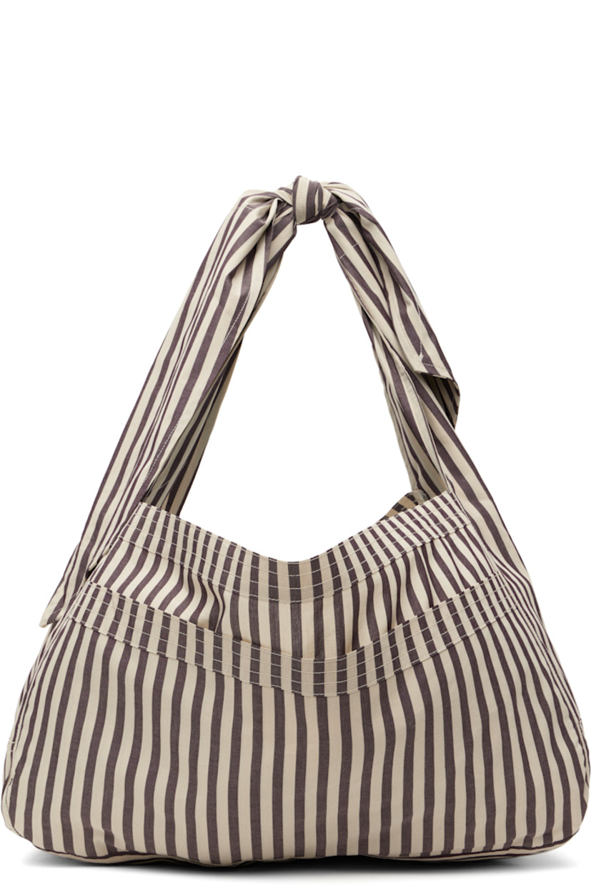 Cotton poplin shoulder bag in taupe and off-white.

· Stripes throughout
· Adjustable self-tie crossbody strap
· Patch pocket at face
· Open throat
· Unlined
· H10.5" x W18" x D7.5"

Supplier color: Net