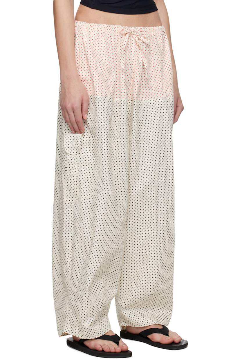 Wide-leg cotton poplin trousers. Polka-dot pattern printed throughout. 

· Drawstring at elasticized waistband
· Two-pocket styling
· Cargo pocket at outseams
· Darts at cuffs 

Supplier color: Dot grid