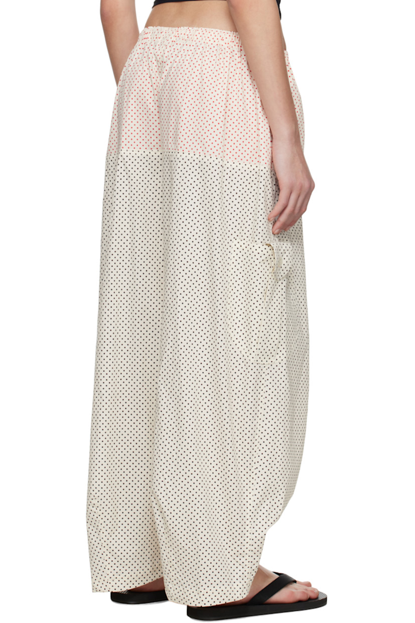 Wide-leg cotton poplin trousers. Polka-dot pattern printed throughout. 

· Drawstring at elasticized waistband
· Two-pocket styling
· Cargo pocket at outseams
· Darts at cuffs 

Supplier color: Dot grid