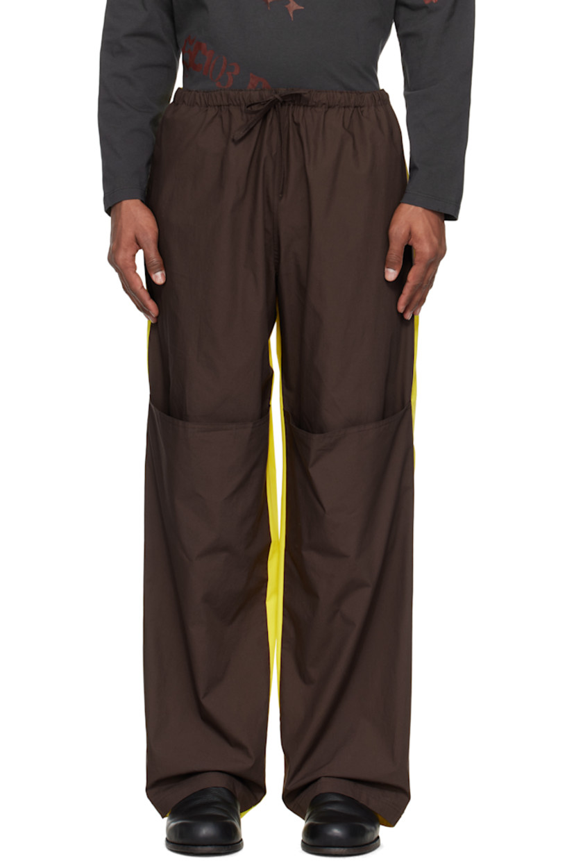 Straight-leg cotton poplin trousers.

· Drawstring at elasticized waistband
· Two-pocket styling
· Tuck at legs
· Contrast trim at inseam and outseams

Available exclusively at SSENSE.

Supplier color: Reverse energy