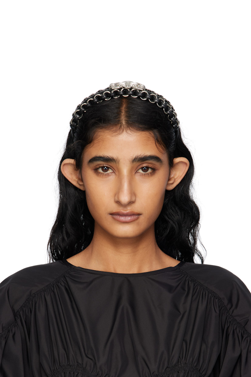 Braided buffed leather headband.

· O-rings throughout
· Graphic hardware at face
· D5.5"

Supplier color: Black